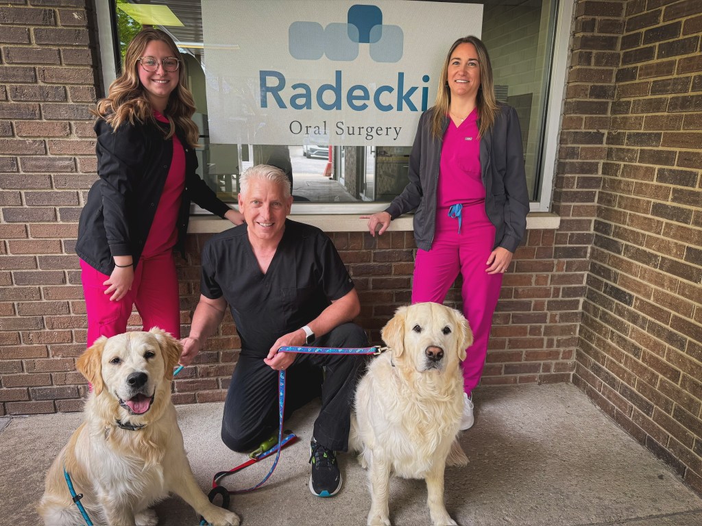 Dr. Radecki with Team and Dogs